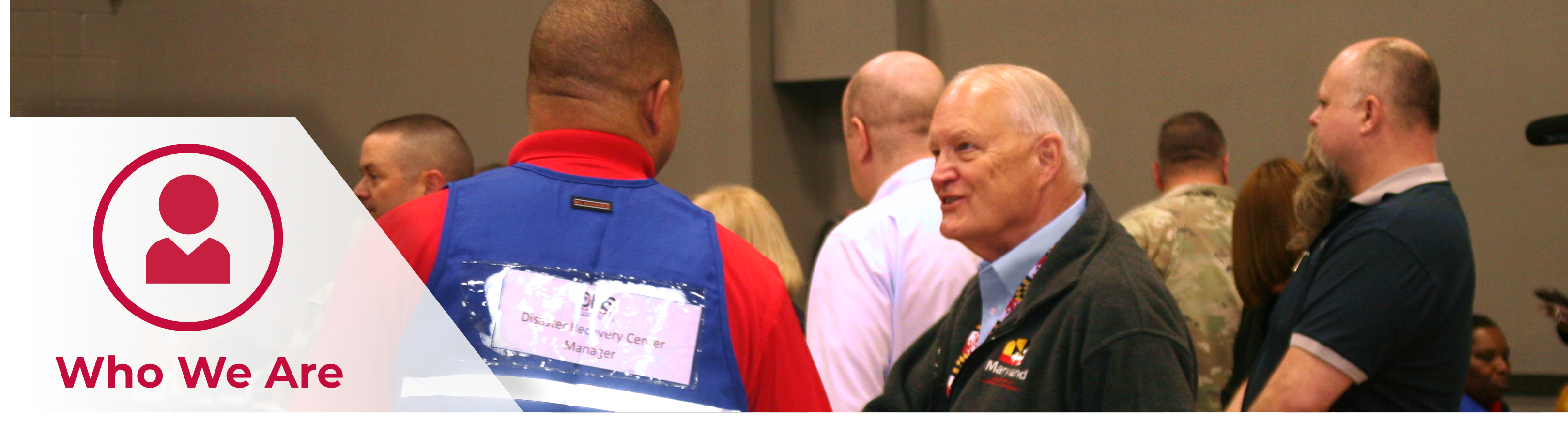 A picture of Secretary Strickland shaking hands with MDEM staff, with the header text, Who We Are